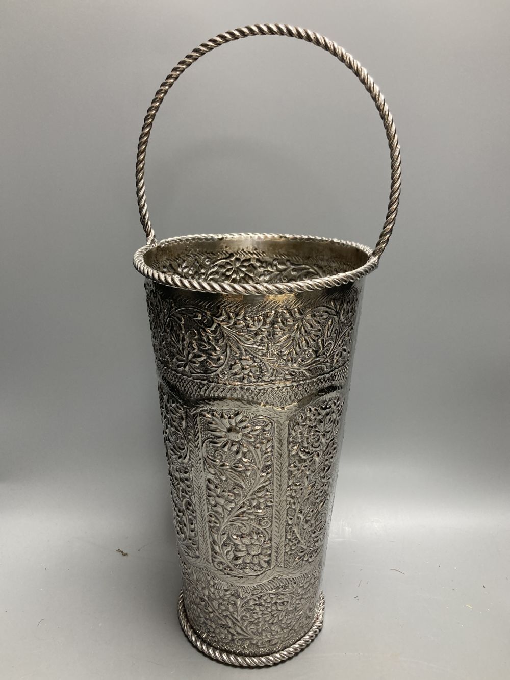A pair of silver plated embossed champagne buckets, 48cm high including handle